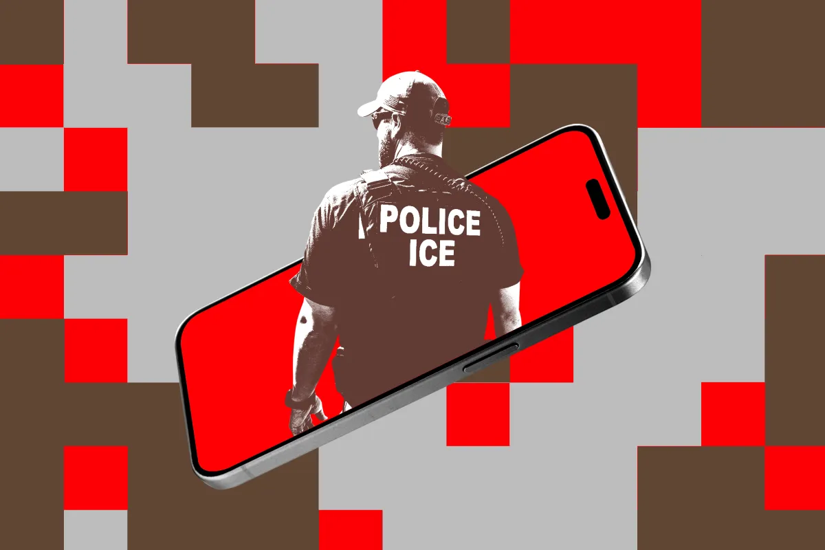 A customs officer inspects a smartphone at a border checkpoint.