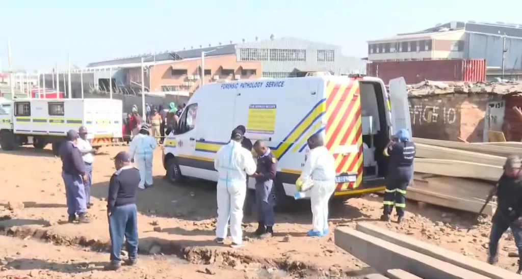 Police secure a crime scene in a Johannesburg informal settlement after a deadly armed attack.
