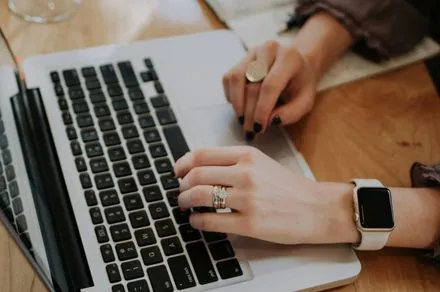 A digital interface displays real time carbon footprint metrics for laptop purchasing decisions.