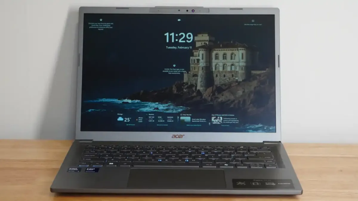 The Acer Aspire 14 AI laptop rests open on a desk with its keyboard and display clearly visible.