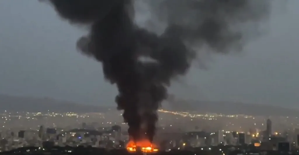Smoke plumes rise over Iranian and Israeli territories following the collapse of the recent ceasefire.