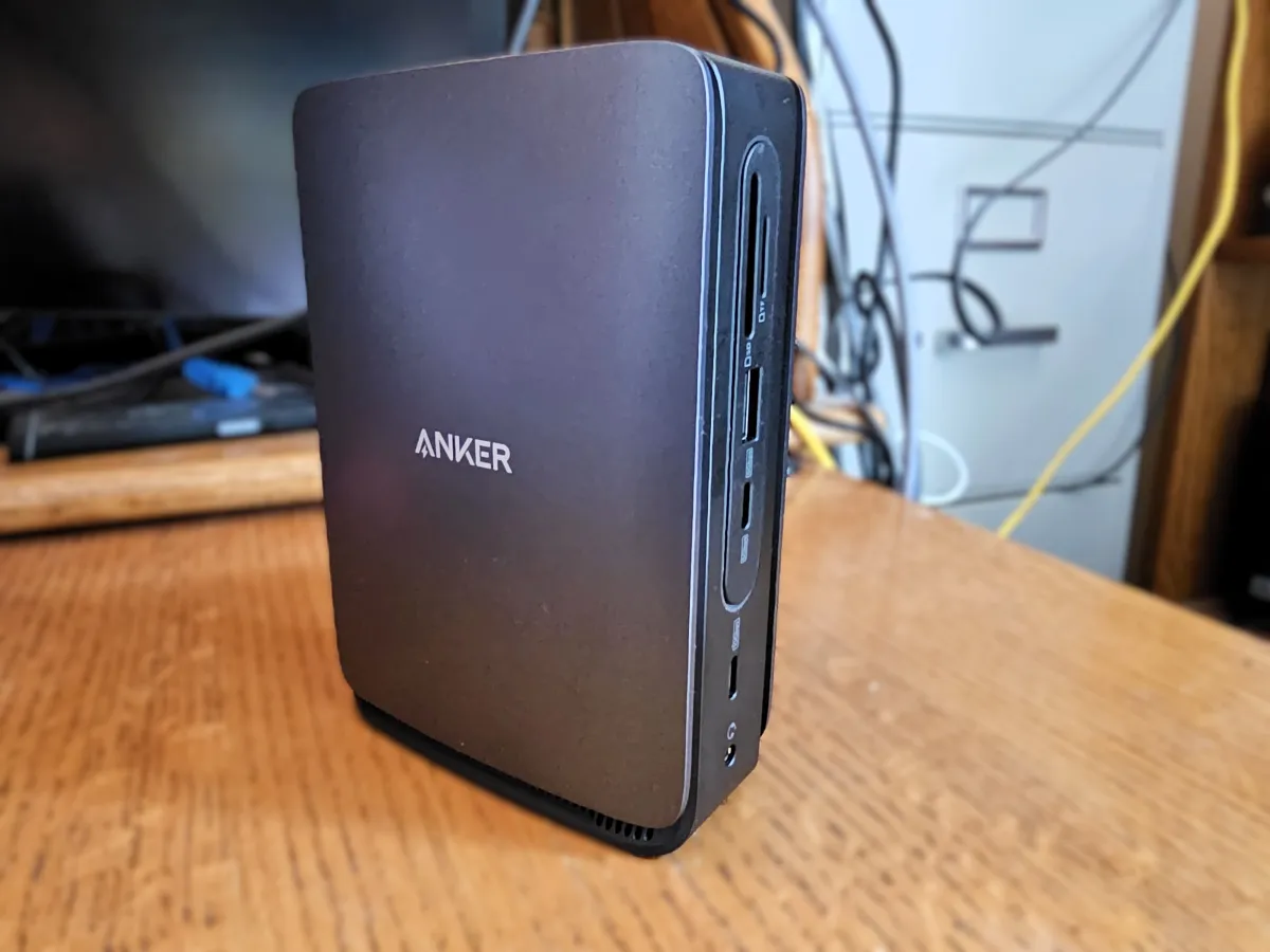 The Anker two-part docking station is shown in desktop and compact travel configurations.