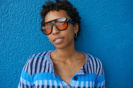 Minimalist smart glasses with a sleek frame and discreet sensors enable hands-free ambient computing.