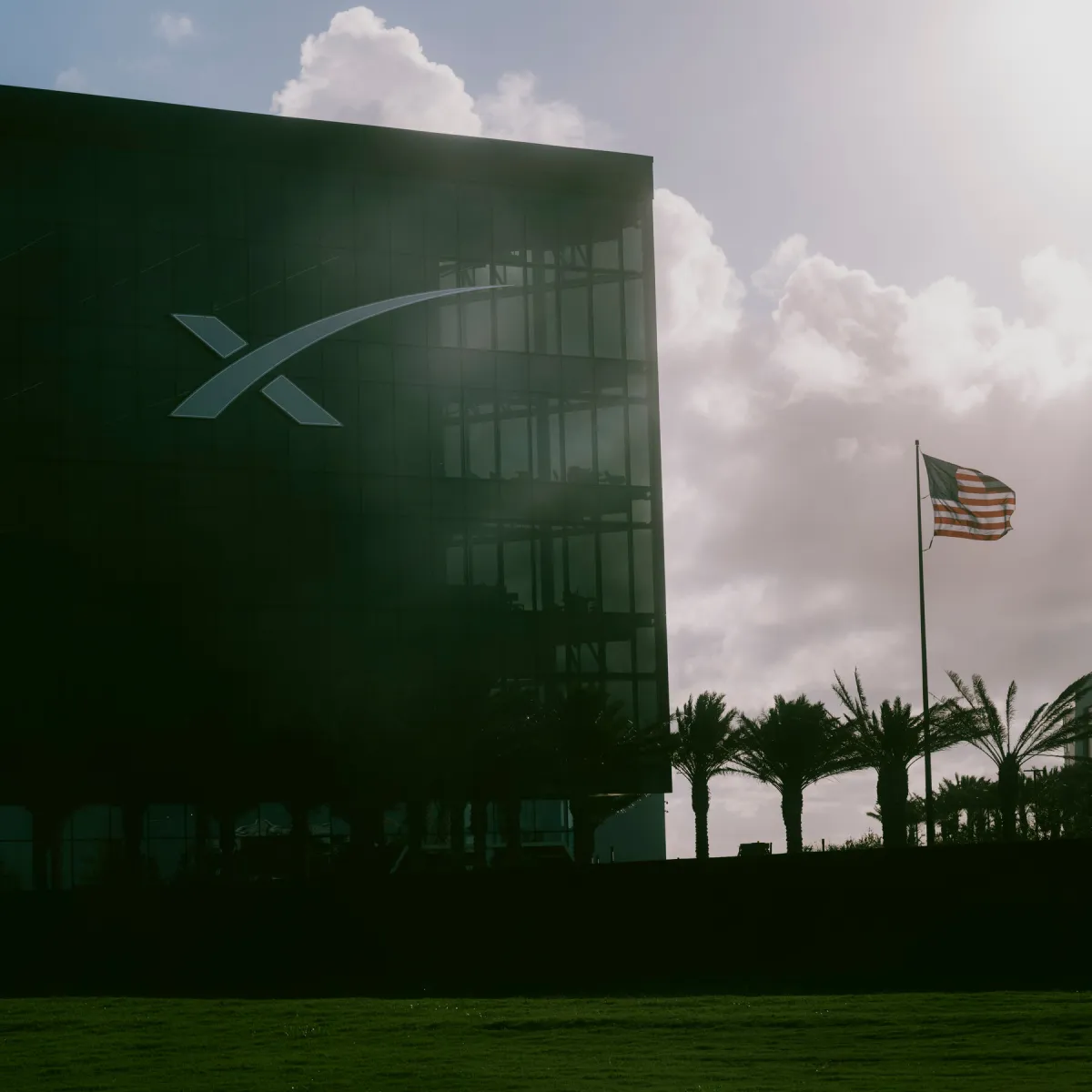 SpaceX logo on a dark background