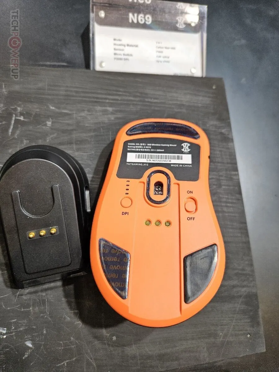 FLEsports N69 wireless mouse with carbon fiber housing and standby dock displayed at Computex 2026.