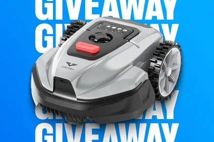 The LEBOSBO V3 robotic lawn mower rests on a green lawn.