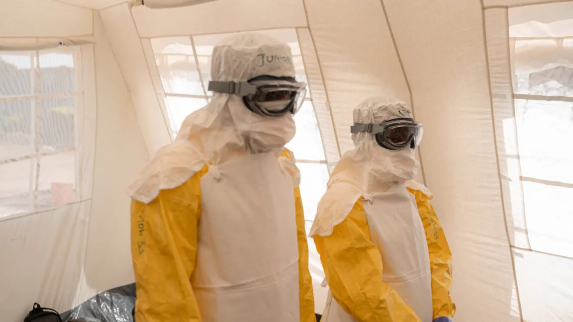 Healthcare workers in protective gear manage an Ebola treatment center in the Democratic Republic of Congo.