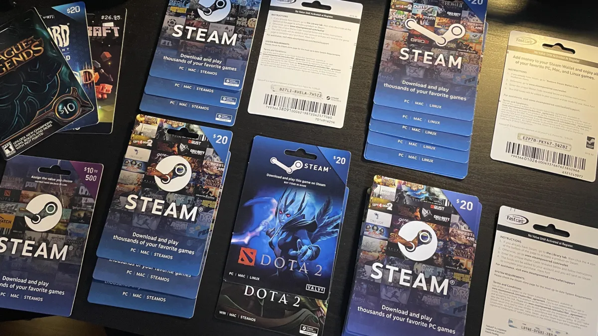 Physical Steam gift cards are shown in retail packaging before Valve ended sales due to fraud.