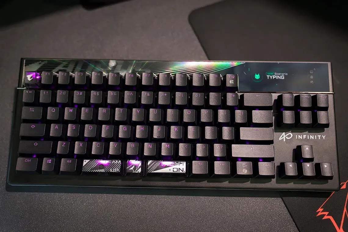 The Gigabyte Aorus K10 Infinity keyboard features magnetic switches and a built-in OLED display.