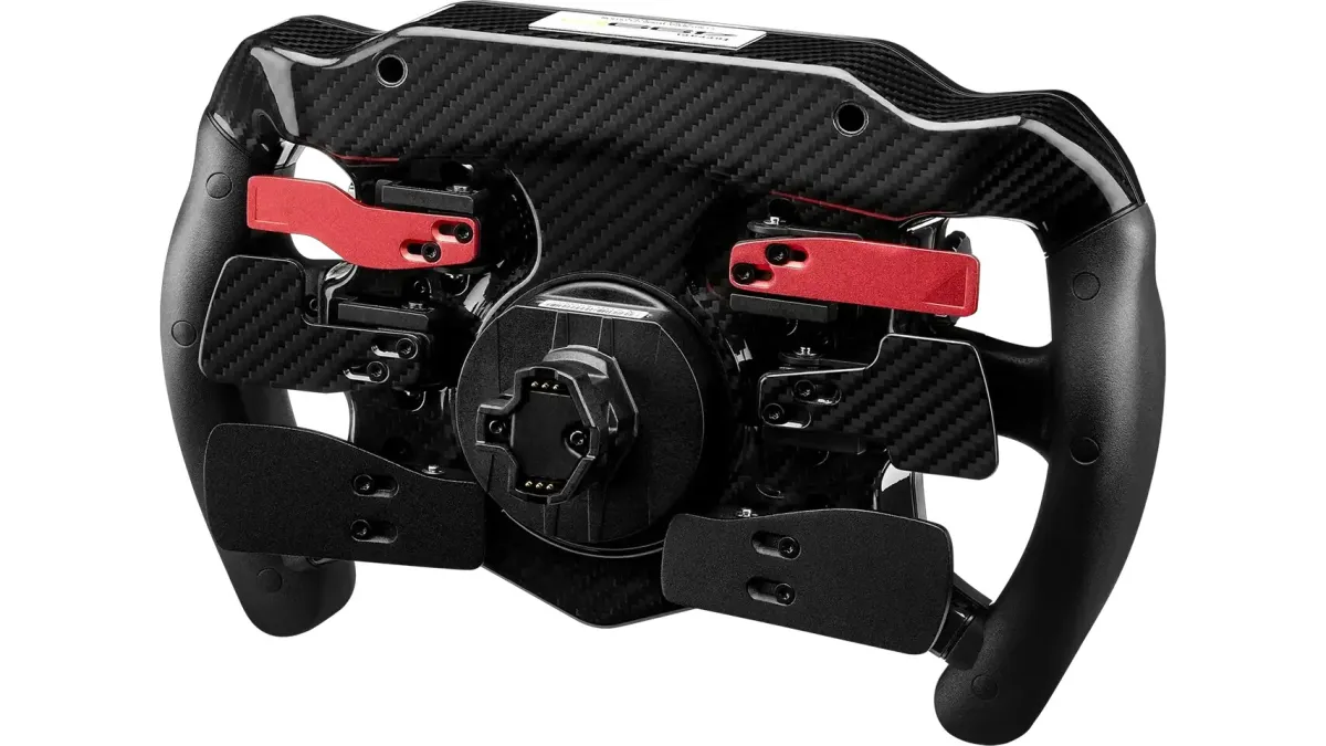 A limited edition Ferrari 499P sim racing wheel features individual serial numbering and Thrustmaster branding.