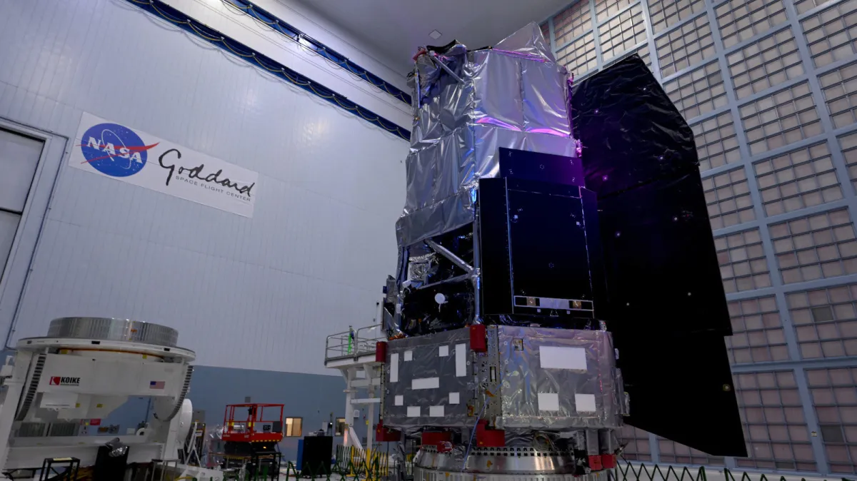 An artist rendering depicts the Nancy Grace Roman Space Telescope deployed in space.