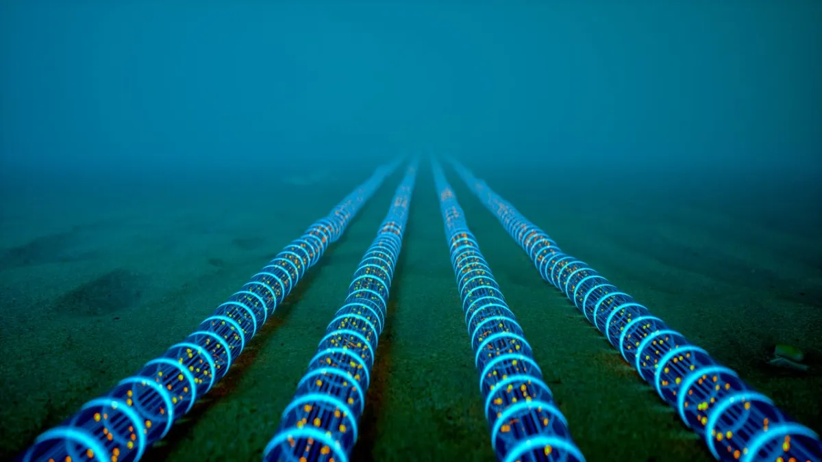 The illustration shows acoustic monitoring sensors deployed along undersea cables to detect seabed vibrations.