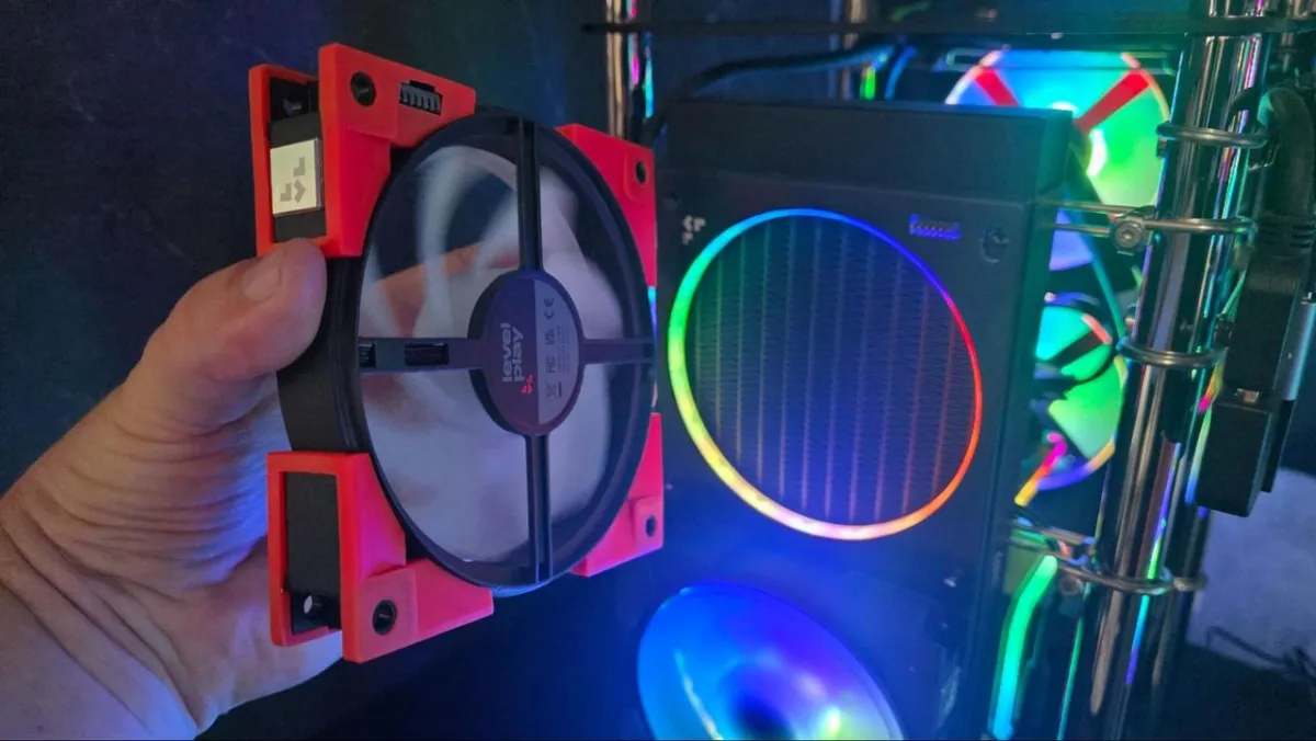 Prototype magnetic fan brackets and a tactile all-in-one cooler displayed at Computex 2026 for desktop thermal management.