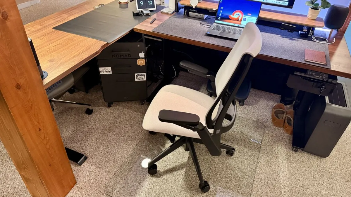 The Ergonofis Equation chair displays a woven textile seat and a weight-activated tilt mechanism.