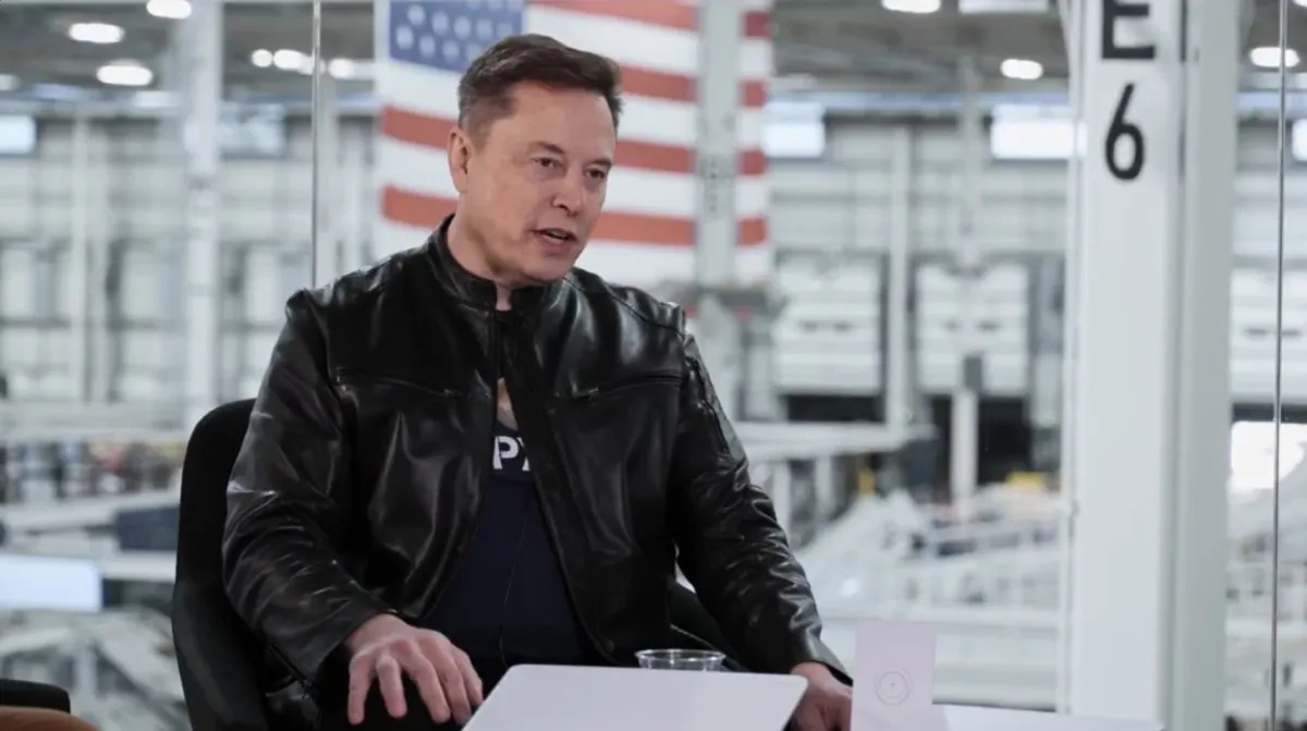 Elon Musk stands near a SpaceX rocket after the company public debut.