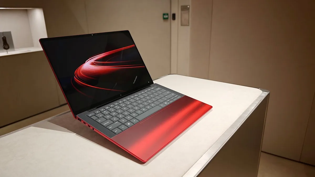 The HP and Ferrari laptop features a red finish and a transparent panel that reveals the internal hardware.
