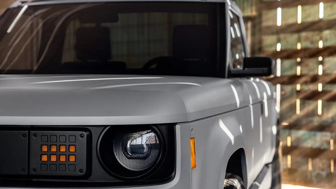 The minimalist electric pickup truck displays a clean exterior profile with no external antennas or tracking hardware.