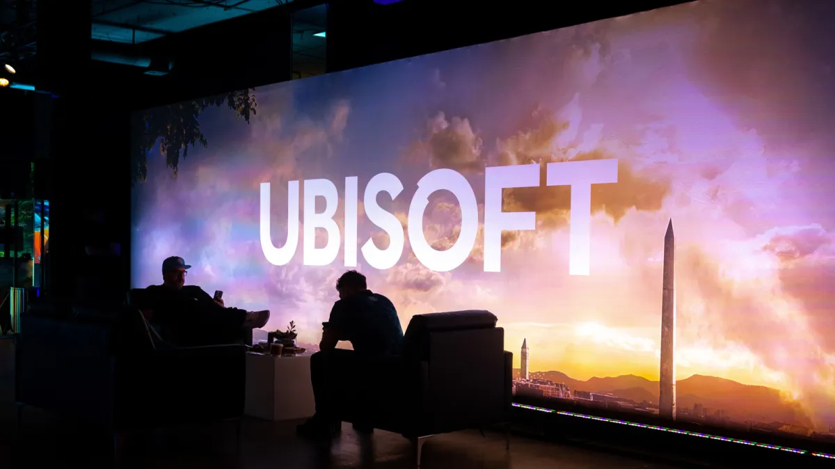 A corporate office building represents Ubisoft global studio restructuring efforts.
