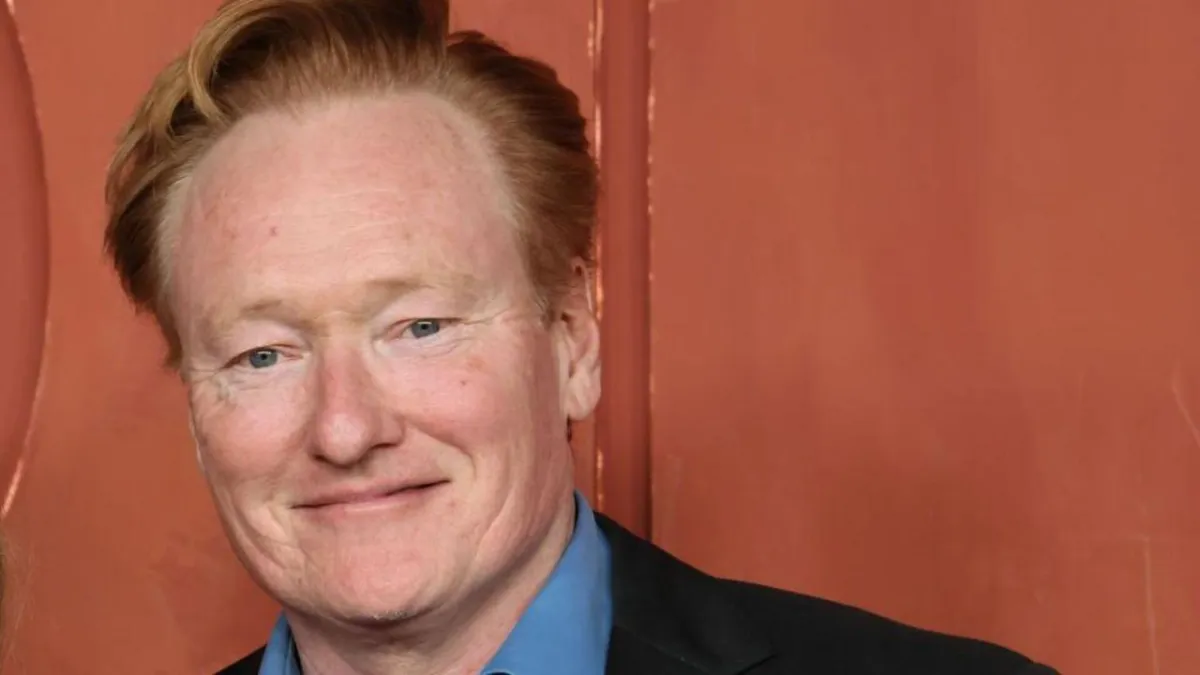 Conan O'Brien presents a comedic cybersecurity training segment focused on combating AI fraud.