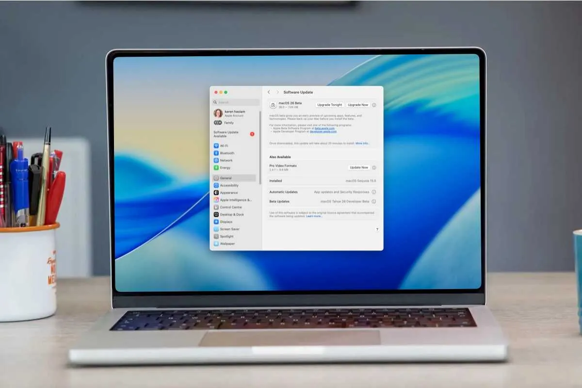 The macOS system settings window displays beta software update enrollment options.