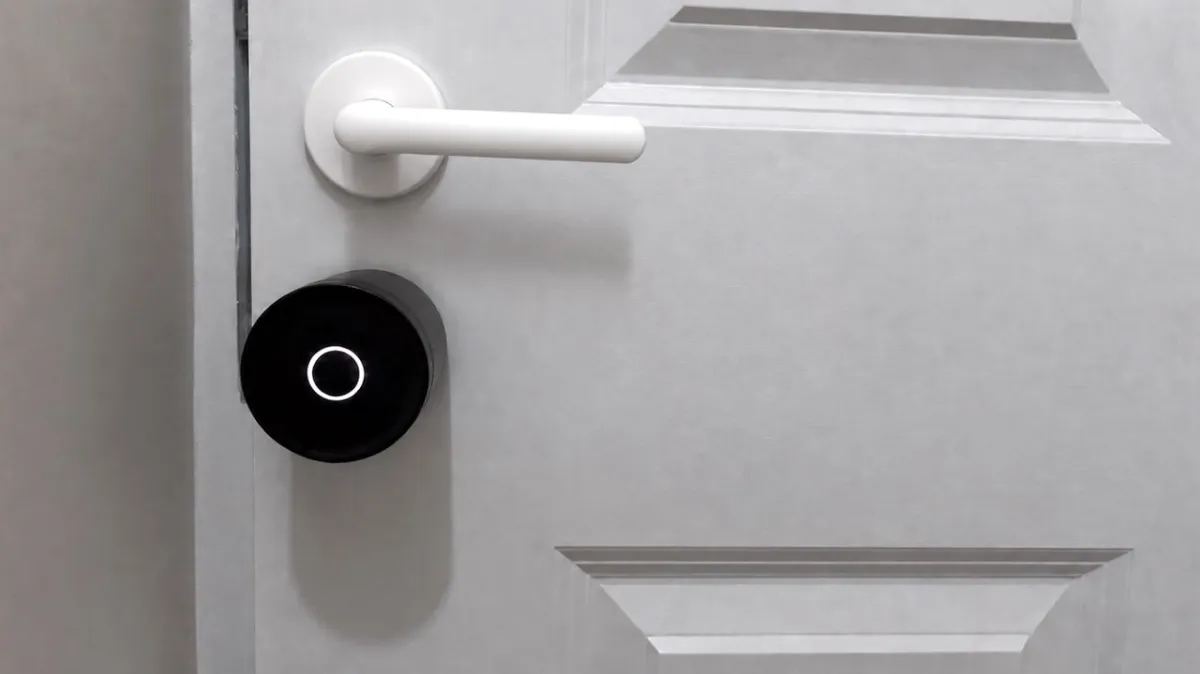 The Yale Linus L2 Lite smart lock is mounted on a standard interior door.