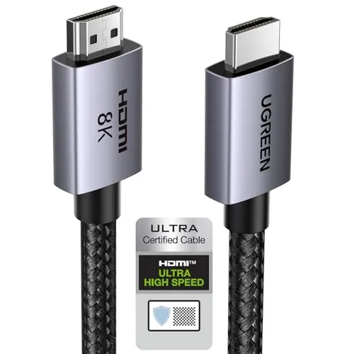 HDMI 2.1 cables with reinforced connectors and certification labels rest on a dark surface.