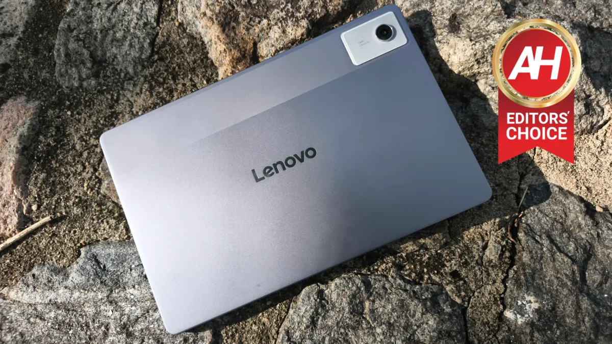 The Lenovo Idea Tab Plus tablet rests on a desk with a digital textbook open on its screen.