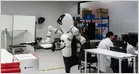 Chinese manufacturers display humanoid robot components at the Humanoids Summit in Tokyo.