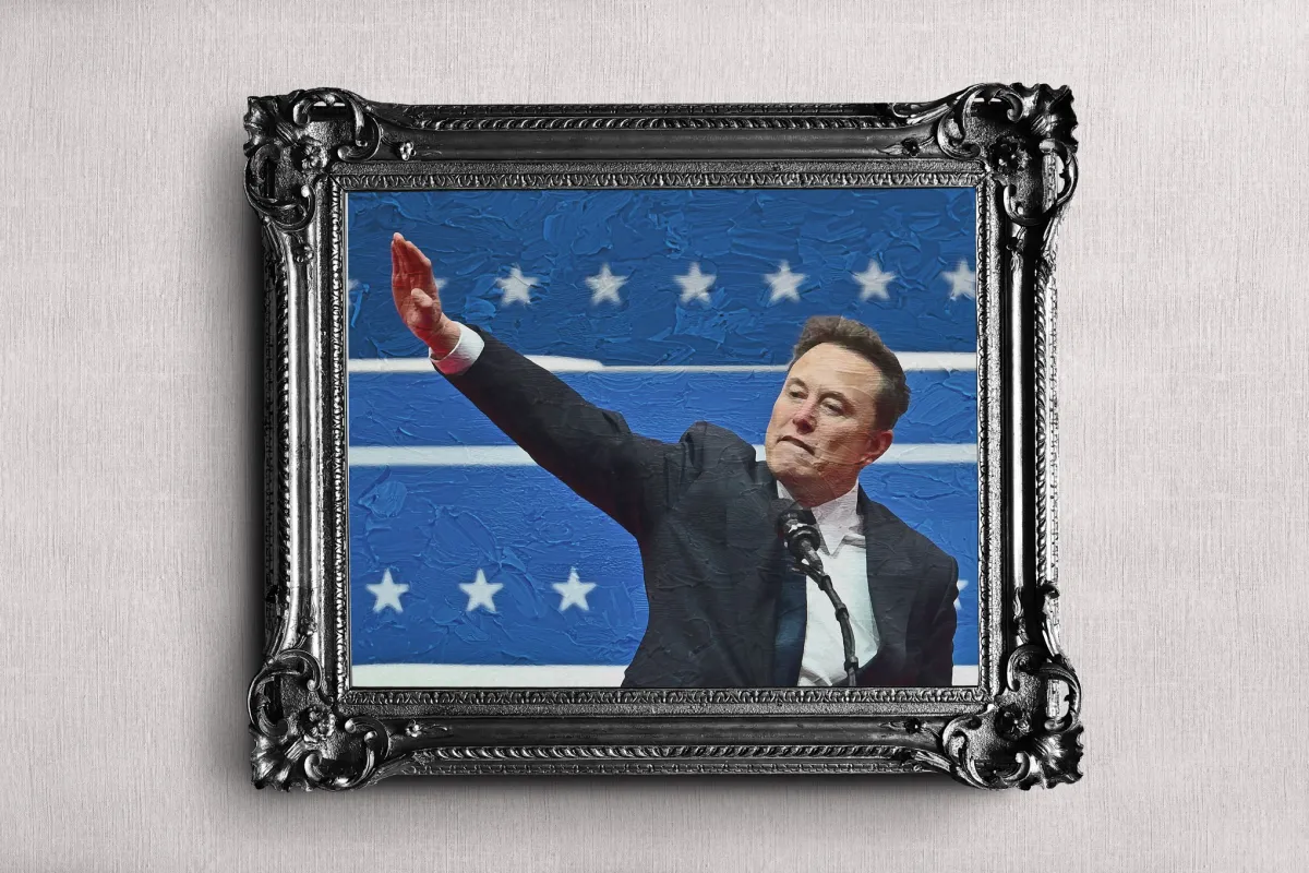 Elon Musk stands beside a SpaceX rocket during a presentation.