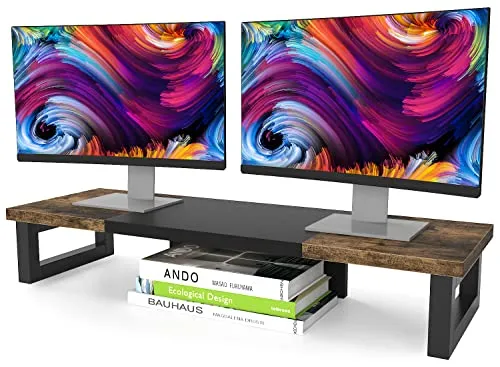 An adjustable metal shelf supports two monitors while routing cables neatly beneath the desk surface.
