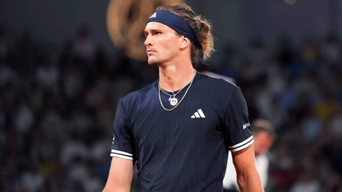 Tennis athletes compete on a red clay court during the 2026 French Open men's final match.