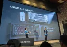 The Gigabyte AORUS INFINITY K10 keyboard and M10 mouse are displayed in black and white configurations.