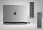 A Thunderbolt docking station connects to a MacBook laptop.