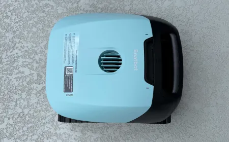 Beatbot Sora 10 robotic pool cleaner positioned on a tiled pool deck.
