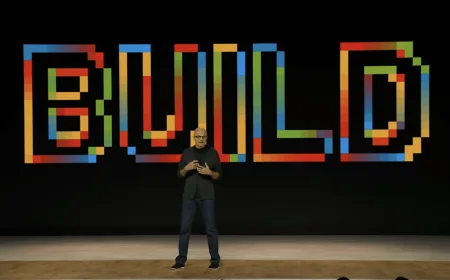 Conference stage at Microsoft Build 2026 displaying announcements for autonomous agents and developer hardware.