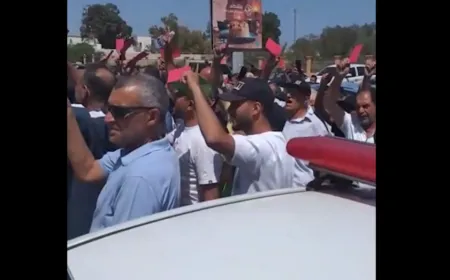 Protesters gather outside a United Nations facility in Tripoli during a demonstration on migration and national sovereignty.
