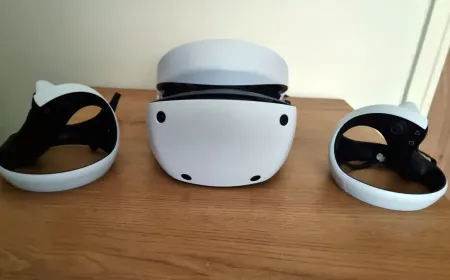 The PlayStation VR2 headset rests on a neutral display stand.