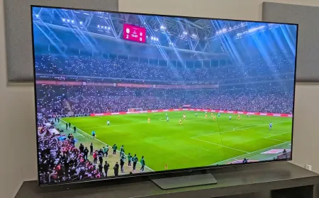Three televisions displaying soccer match footage to illustrate motion handling and brightness differences.