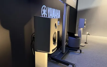 The Yamaha NX-70A wireless speakers feature a compact cylindrical design and a minimalist front panel.