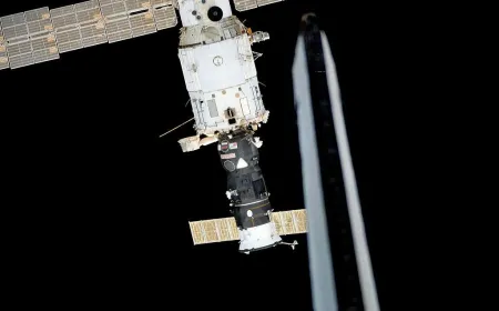 Space station module showing the decommissioned transfer tunnel and structural components in orbit.