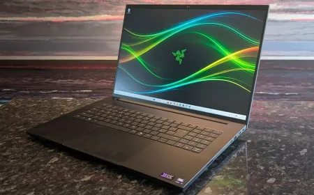 The 2026 Razer Blade 18 laptop is shown with its slim chassis and keyboard visible.