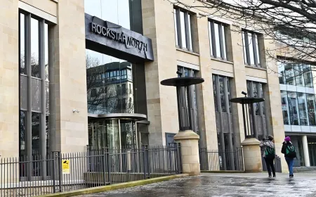 A person records audio and environmental data outside Rockstar North headquarters.