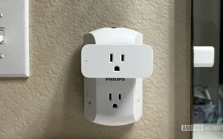 Two Amazon smart plugs with attached power cords and indicator lights