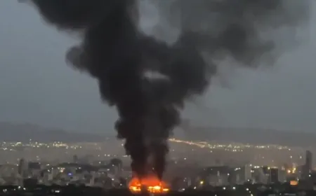 Smoke plumes rise over Iranian and Israeli territories following the collapse of the recent ceasefire.
