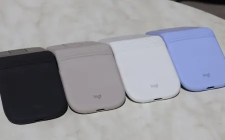 Logitech Mobi Fold mouse shown in a compact folded configuration with a textured rubberized exterior.