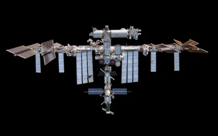 ISS crew members shelter in a SpaceX Crew Dragon lifeboat during an emergency protocol triggered by a Russian module leak.