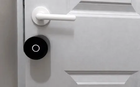 The Yale Linus L2 Lite smart lock is mounted on a standard interior door.