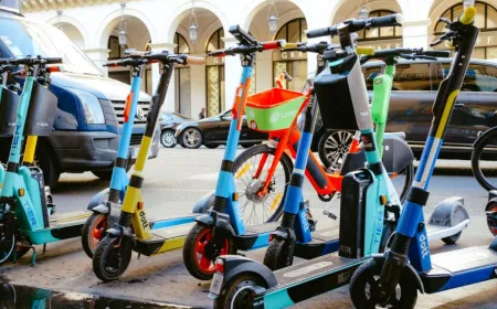 Rental e-scooters are parked along a Brussels street ahead of the municipal ban.