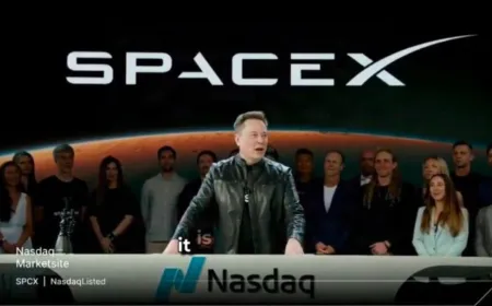 Elon Musk speaks at a podium during a SpaceX corporate event.