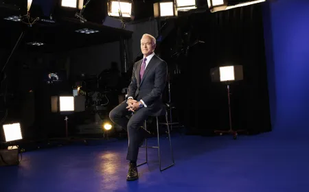 A CBS news broadcast studio and corporate headquarters illustrating media consolidation trends.